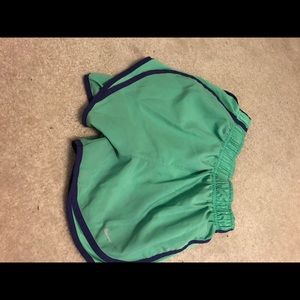 two pairs of nike shorts, both sizes XS